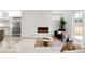 Open-concept living room with a modern fireplace and neutral decor at 4201 Vallejo St, Denver, CO 80211