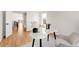 A office space is bathed in natural light, showing hardwood floors and modern furniture, ideal for creativity and focus at 4201 Vallejo St, Denver, CO 80211