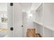 A spacious walk-in closet with built-in shelves and ample storage space, perfect for organizing your wardrobe at 4201 Vallejo St, Denver, CO 80211