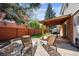 Backyard patio with lounge chairs offers an inviting space for relaxation at 8201 Allison Ct, Arvada, CO 80005