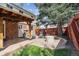 Backyard features a cozy patio with a fire pit, perfect for outdoor gatherings at 8201 Allison Ct, Arvada, CO 80005