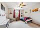 A bedroom featuring playful decor, a ceiling fan, and a comfortable single bed at 8201 Allison Ct, Arvada, CO 80005
