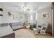 A Bedroom with a gray crib, comfortable glider, and soft, neutral decor at 8201 Allison Ct, Arvada, CO 80005