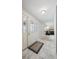Bright foyer with marble floors, decorative glass front door, and view of the living room at 8201 Allison Ct, Arvada, CO 80005