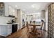 Large eat-in kitchen features stainless appliances, breakfast bar, and plenty of counter space at 8201 Allison Ct, Arvada, CO 80005