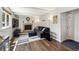 Spacious living room features a fireplace, wood floors, and a large window at 8201 Allison Ct, Arvada, CO 80005
