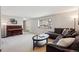 Inviting living room with plush carpeting, large picture window, and neutral decor at 8201 Allison Ct, Arvada, CO 80005