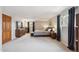 A spacious main bedroom with a large bed, warm colors, and lots of natural light at 8201 Allison Ct, Arvada, CO 80005