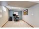 A basement office space with a desk, artwork, and neutral color scheme at 8201 Allison Ct, Arvada, CO 80005