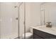 Modern bathroom with glass enclosed shower, white subway tile, and sleek vanity at 370 N. Geneva St, Aurora, CO 80010