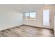 Bedroom with hardwood floor, ample natural light and access to exterior door at 370 N. Geneva St, Aurora, CO 80010