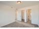 Bright bedroom with carpet, neutral walls, walk-in closet, and bathroom access at 370 N. Geneva St, Aurora, CO 80010