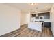 Modern kitchen featuring an island, stainless steel appliances, and sleek countertops at 370 N. Geneva St, Aurora, CO 80010