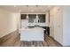 Modern kitchen with pendant lighting, island seating, and stainless steel appliances at 370 N. Geneva St, Aurora, CO 80010