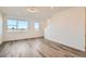 Bright living room with hardwood floors, natural light, and large windows at 370 N. Geneva St, Aurora, CO 80010