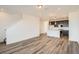Open-concept living room and kitchen area featuring modern design and hardwood floors at 370 N. Geneva St, Aurora, CO 80010