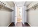 Walk-in closet has shelving and hanging racks for optimal storage at 3339 S Monaco Pkwy # A, Denver, CO 80222