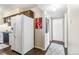 Functional kitchen area with essential appliances and adjacent hallway with closets at 3339 S Monaco Pkwy # A, Denver, CO 80222