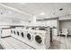Laundry room features multiple washing machines at 3339 S Monaco Pkwy # A, Denver, CO 80222