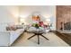 Inviting living room features comfortable seating, a glass table and a brick fireplace at 3339 S Monaco Pkwy # A, Denver, CO 80222