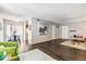 Spacious living space featuring hardwood floors and a view of the dining area and kitchen at 3339 S Monaco Pkwy # A, Denver, CO 80222