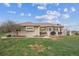 Lush backyard with a well-manicured lawn and charming patio area at 11064 Hermitage Run, Littleton, CO 80125