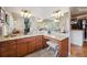 Spacious bathroom with double vanity, granite countertops, and modern lighting at 11064 Hermitage Run, Littleton, CO 80125