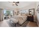 Bedroom with outdoor patio access, plush rug, and stylish furnishings at 11064 Hermitage Run, Littleton, CO 80125