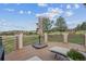 Outdoor deck with views, chairs and sunshade at 11064 Hermitage Run, Littleton, CO 80125