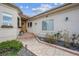 Charming front entrance with a well-maintained walkway and tasteful landscaping at 11064 Hermitage Run, Littleton, CO 80125