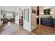 Inviting interior hallway with decorative accents and elegant hardwood flooring that adds warmth and character at 11064 Hermitage Run, Littleton, CO 80125