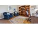 Cozy home office featuring built-in bookshelves and comfortable seating at 11064 Hermitage Run, Littleton, CO 80125