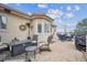 Inviting outdoor patio with fire pit, comfortable seating, and covered dining area at 11064 Hermitage Run, Littleton, CO 80125
