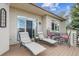 Cozy patio with comfortable lounge chairs and outdoor seating, ideal for relaxation and entertaining at 11064 Hermitage Run, Littleton, CO 80125