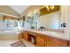 Bright bathroom features a double vanity, soaking tub, and large windows with views of the trees at 1977 Champions Cir, Castle Rock, CO 80104