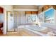 Spacious bathroom with glass enclosed shower, soaking tub and large window with scenic outdoors view at 1977 Champions Cir, Castle Rock, CO 80104