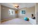 Bedroom with two large windows, neutral walls, and a ceiling fan at 1977 Champions Cir, Castle Rock, CO 80104