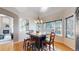 Bright breakfast nook with a window view, stylish pendant lighting, and hardwood floors at 1977 Champions Cir, Castle Rock, CO 80104
