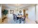 Tasteful dining room with tray ceiling, chandelier, and decorative wall trim at 1977 Champions Cir, Castle Rock, CO 80104