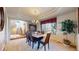 Elegant dining room with tray ceiling, chandelier, and large windows at 1977 Champions Cir, Castle Rock, CO 80104