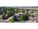 Beautifully landscaped home featuring lush greenery and a well-manicured front yard in a quiet suburban neighborhood at 1977 Champions Cir, Castle Rock, CO 80104