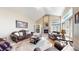 Inviting living room with fireplace, built-in shelving, and comfortable seating at 1977 Champions Cir, Castle Rock, CO 80104