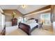 Cozy main bedroom boasts vaulted ceilings, large windows, ensuite bath, and plenty of space at 1977 Champions Cir, Castle Rock, CO 80104