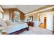 Bright main bedroom boasts vaulted ceilings, large windows, and hardwood floors beyond doorway at 1977 Champions Cir, Castle Rock, CO 80104