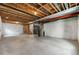 Unfinished basement space with exposed ceiling and concrete flooring at 6387 Agave Ave, Castle Rock, CO 80108