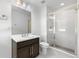 Bathroom with a glass-enclosed shower, modern fixtures, and vanity at 6387 Agave Ave, Castle Rock, CO 80108