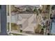 Aerial view of the house, showcasing the roof, patio, yard, and surrounding landscaping at 6746 S Biloxi Ct, Aurora, CO 80016