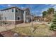 Landscaped backyard featuring stone accents, a small lawn, and a covered patio at 6746 S Biloxi Ct, Aurora, CO 80016