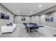 Finished basement featuring recessed lighting, a sofa, and a ping pong table at 6746 S Biloxi Ct, Aurora, CO 80016