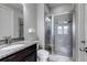 Bathroom featuring a granite vanity and a glass-enclosed shower at 6746 S Biloxi Ct, Aurora, CO 80016